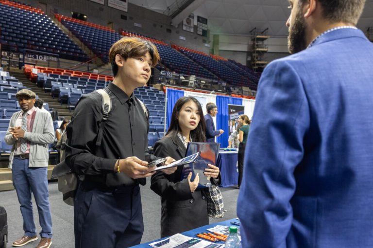 Students being recruited at the job fair