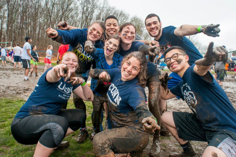 Students posing for a photo while playing oozeball